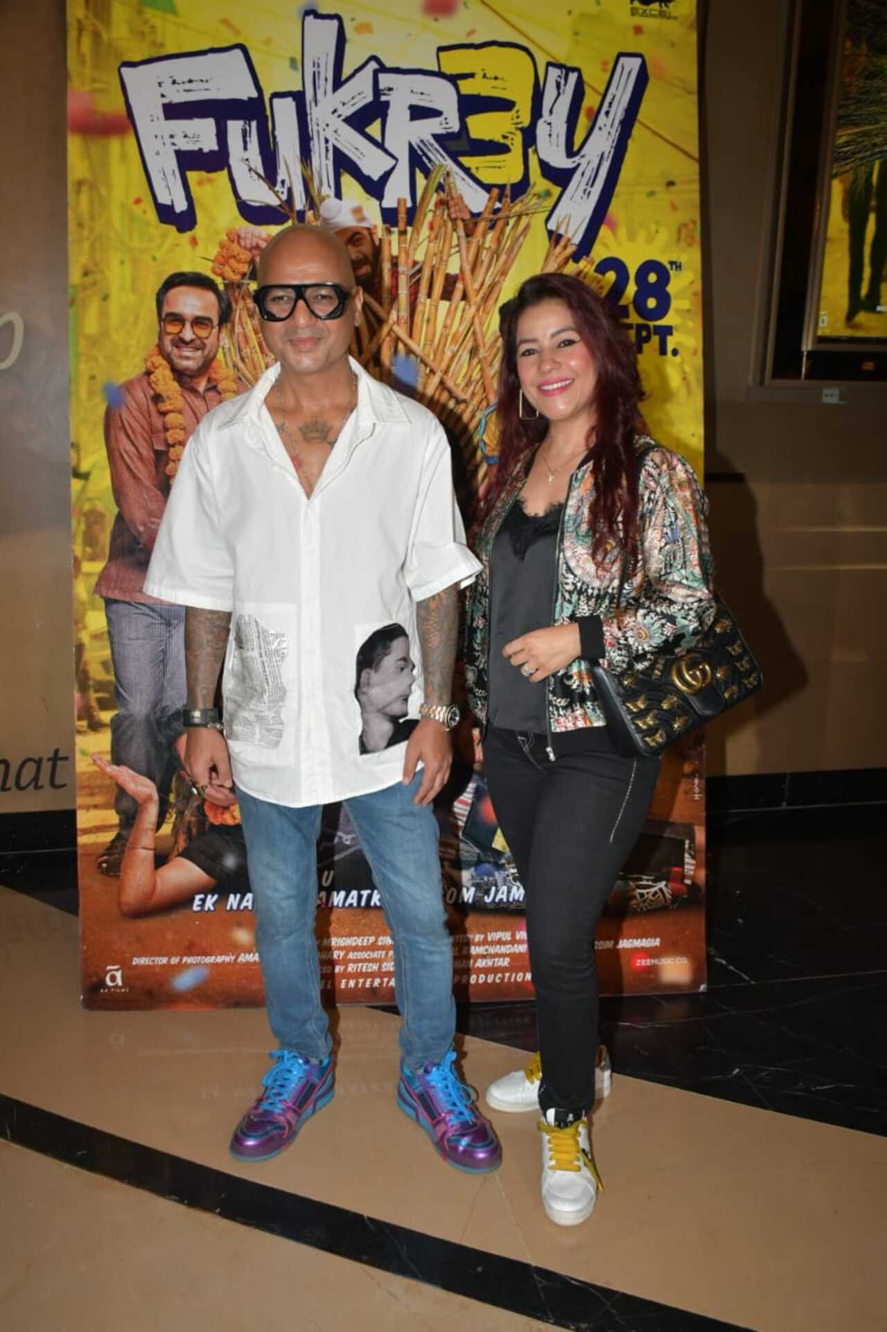 Celebrity hairstylist Aalim Hakim arrived with his wife for the screening